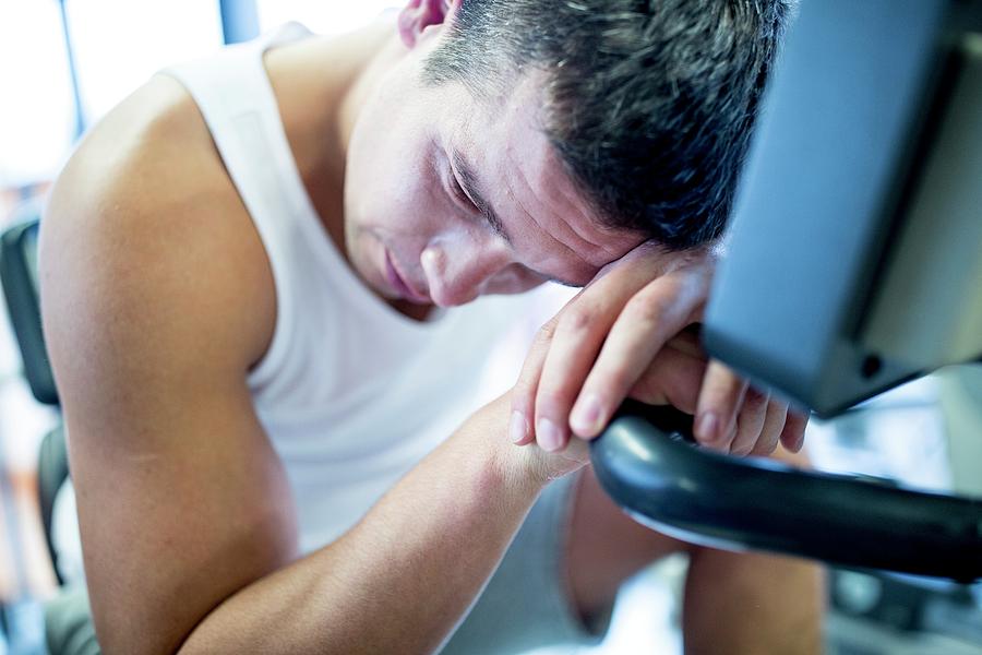 Man Resting His Head On Exercise Machine Photograph By Science Photo Library Fine Art America