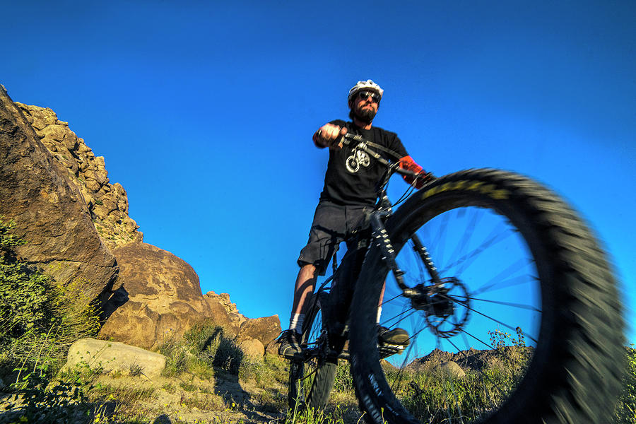 Holding Photograph - Man Riding Mountain Bike On Dirt Track #1 by Bennett Barthelemy