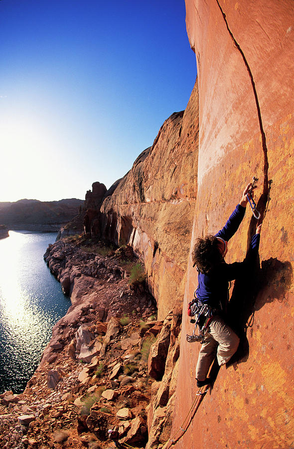 Man Rock Climbing On A Sandstone Cliff Photograph By Corey Rich