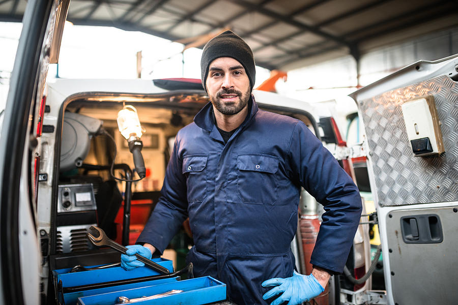 Mechanic Technician On A Garage #1 Photograph by Franckreporter