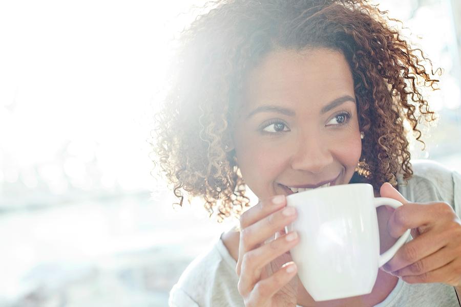 Mid Adult Woman Drinking Coffee #1 Photograph by Science Photo Library ...