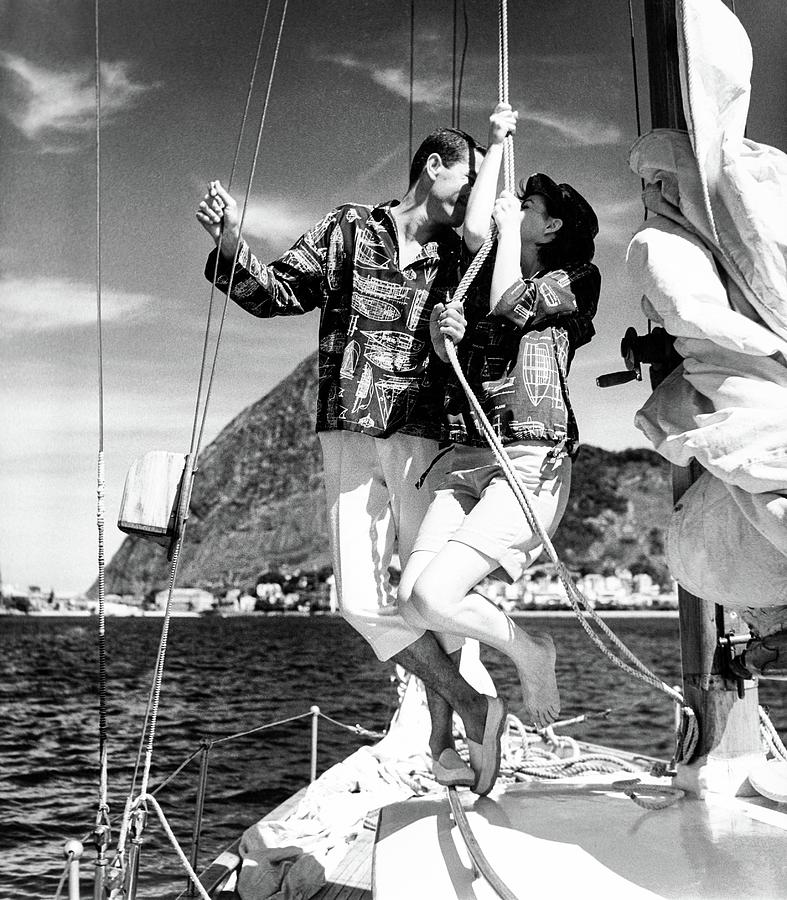 Rope Photograph - Models Wearing A Bennett Shirts On A Sailboat #1 by Richard Waite