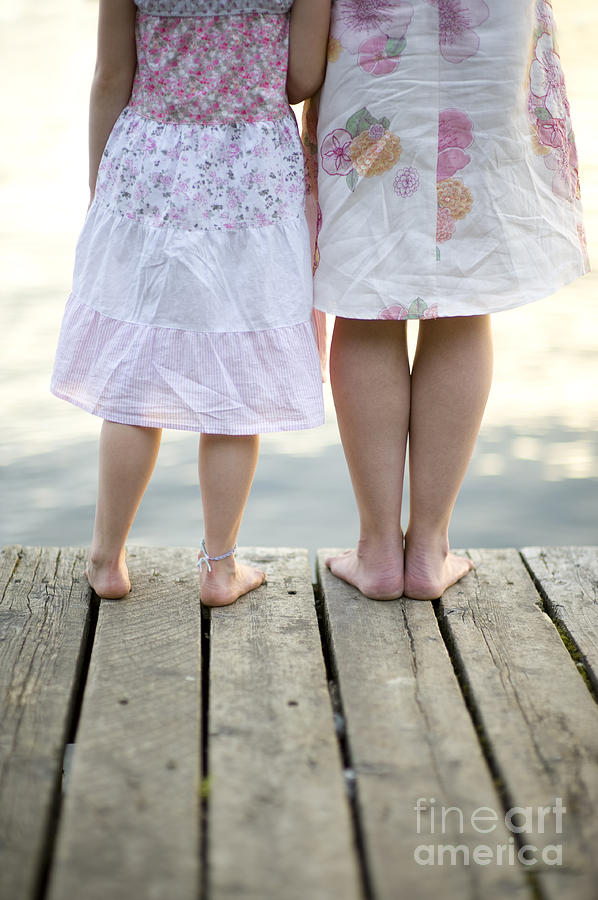 Mother And Daughter On A Wooden Board Walk #1 Photograph by Lee Avison