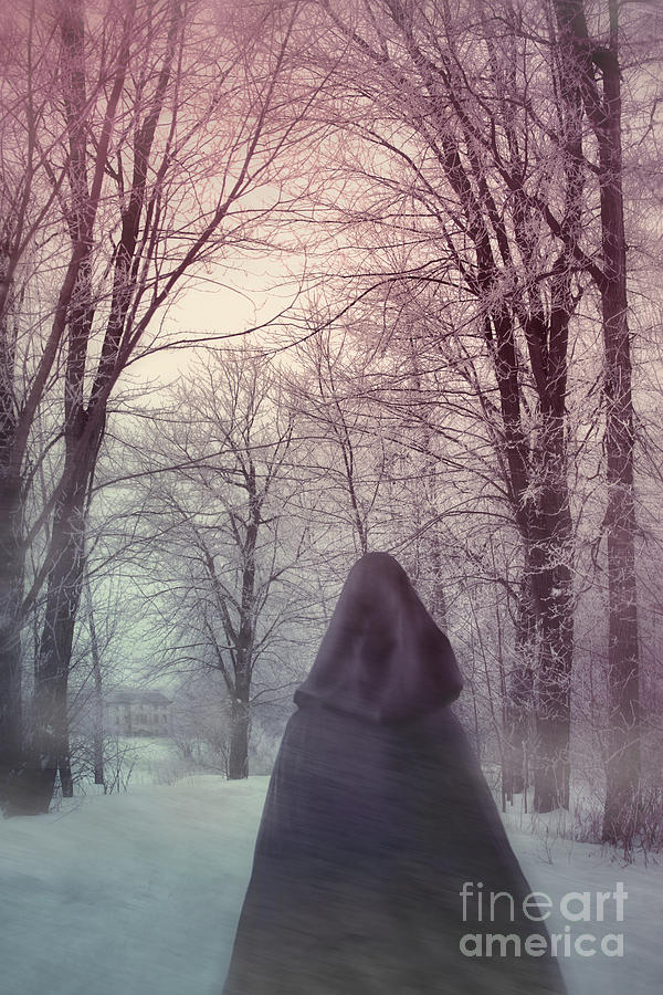 Mysterious Woman wearing cloak walking in snow #1 Photograph by Sandra Cunningham