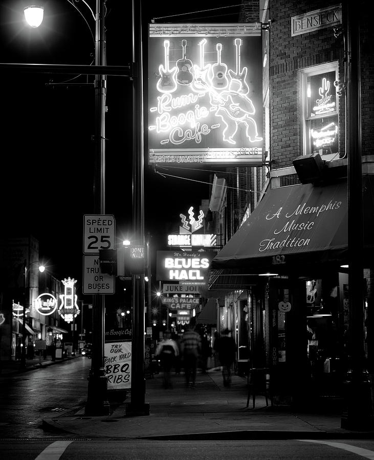 Black And White Photograph - Neon Sign Lit Up At Night In A City #1 by Panoramic Images