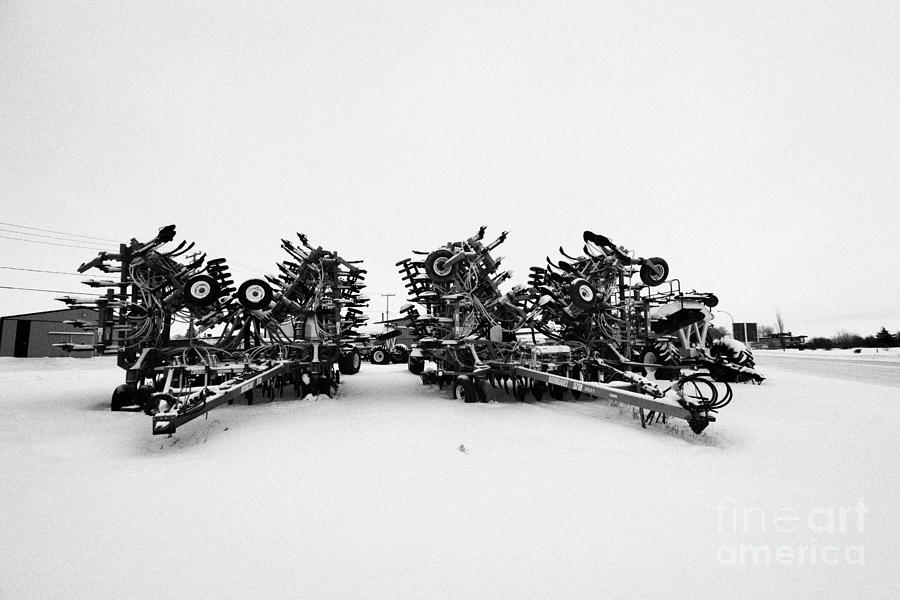 Drill Photograph - new bourgault 5710 air hoe drill covered in snow in winter Kamsack Saskatchewan Canada #1 by Joe Fox