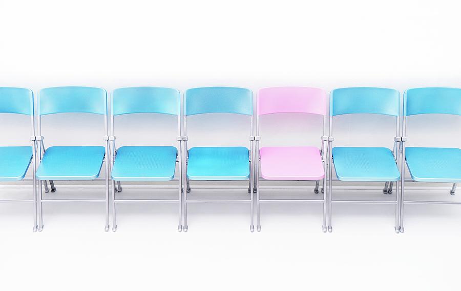 One Pink Chair In A Row Of Blue Chairs #1 Photograph by Cordelia Molloy/science Photo Library
