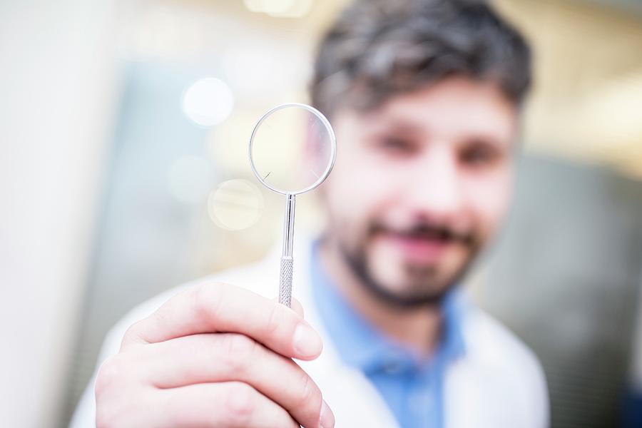 Optometrist With Magnifying Glass 1 Photograph By Science Photo Library Pixels 6285