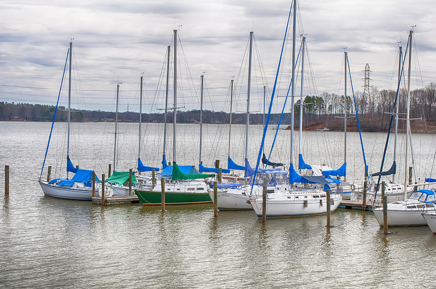 Parked Yachts In Harbour With Cloudy Skies #1 Photograph by Alex Grichenko