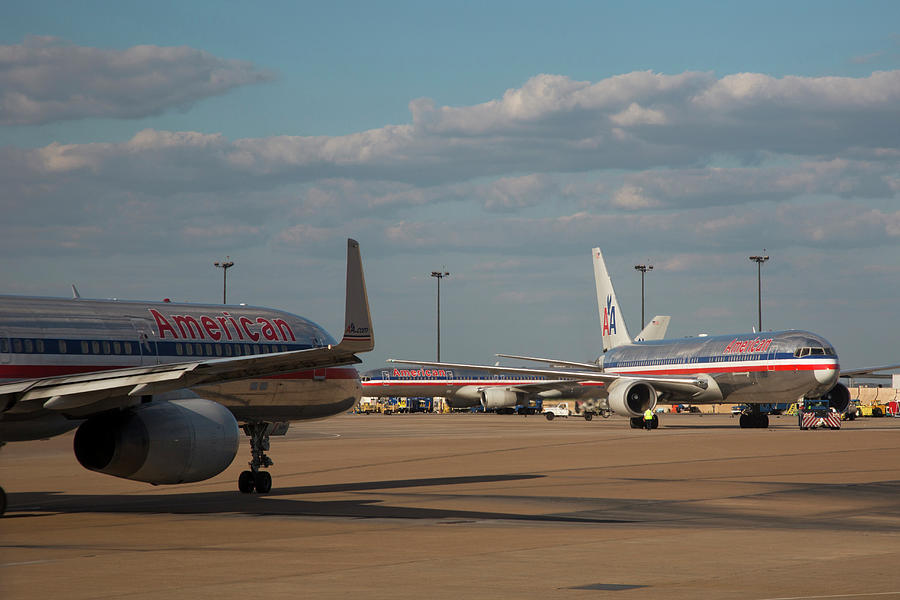 Passenger Airliners At An Airport Photograph by Jim West