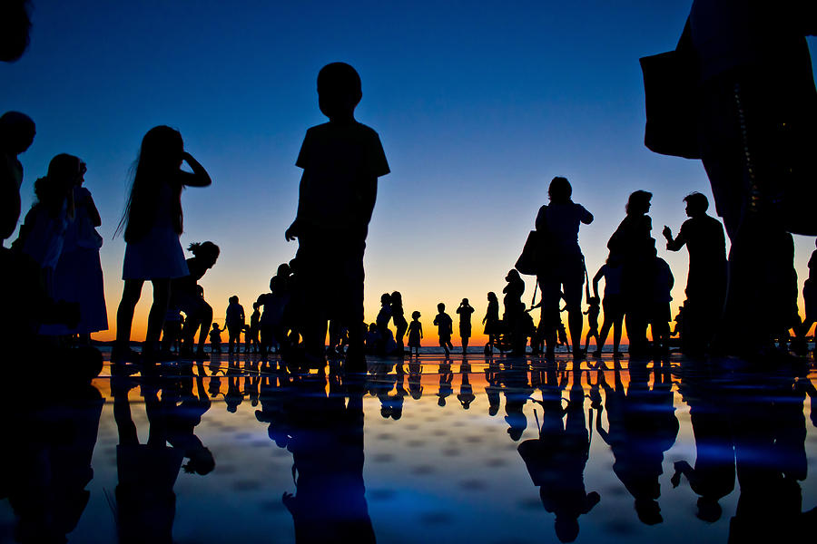 People reflections on colorful sunset #1 Photograph by Brch Photography