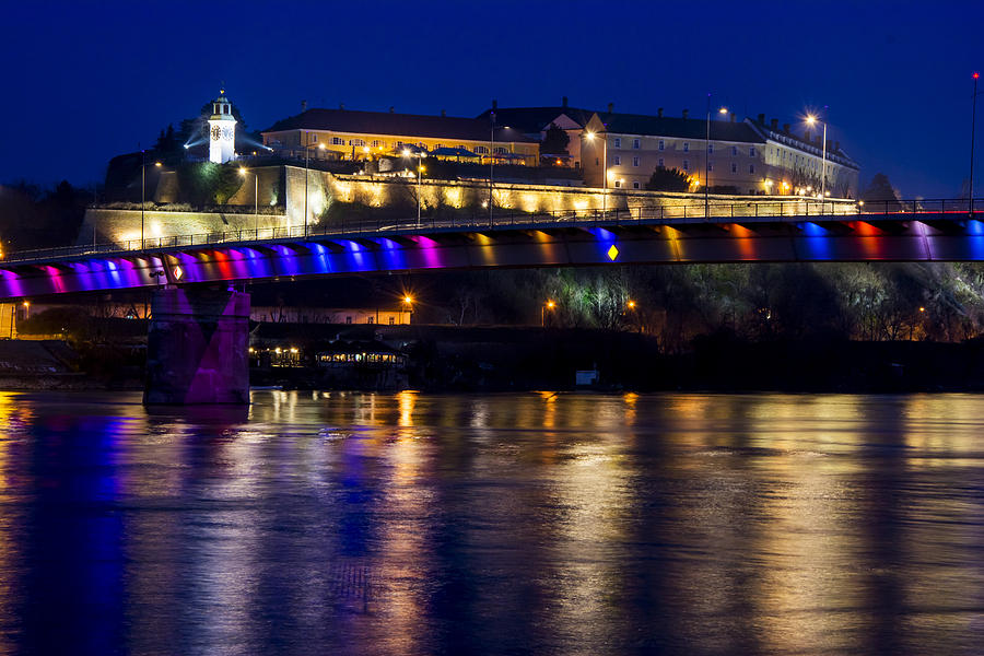 Architecture Photograph - Petrovaradin fortress with rainbow bridge in the night #1 by Newnow Photography By Vera Cepic