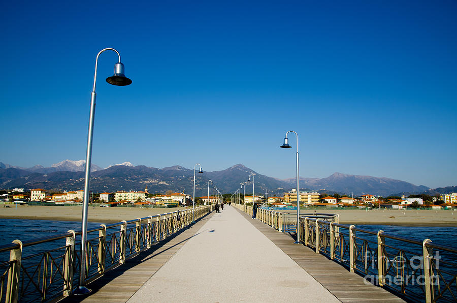Pier and snow-capped mountain #1 Photograph by Mats Silvan