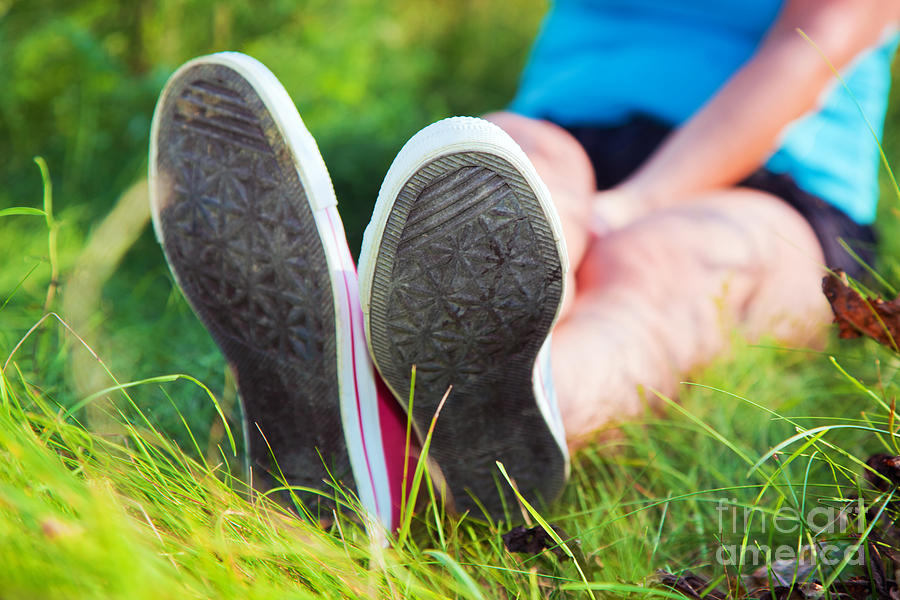Summer Photograph - Pink sneakers on girl legs on grass #1 by Michal Bednarek