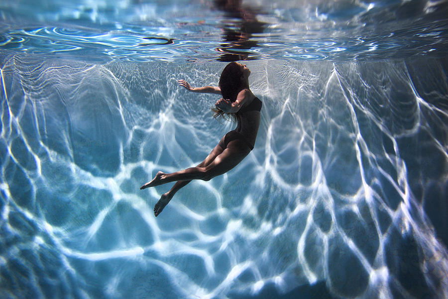 Portrait of a female model underwater in a swimming pool with a in San Diego, California. #1 Photograph by K.C. Alfred