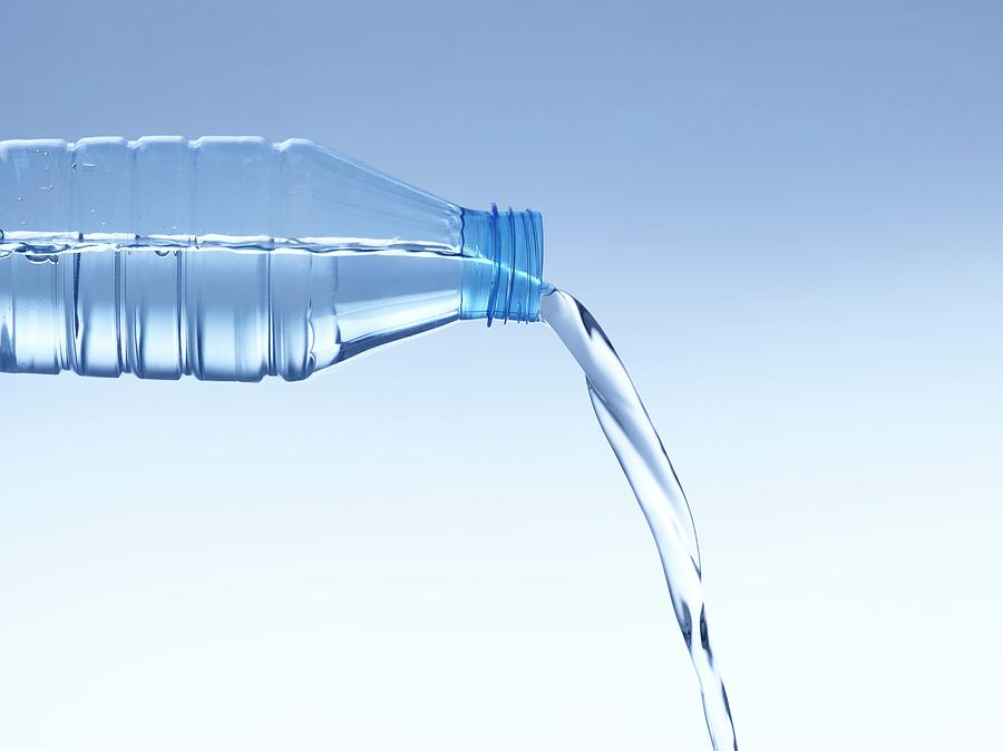 Pouring Water From Bottle Photograph by Science Photo Library | Fine