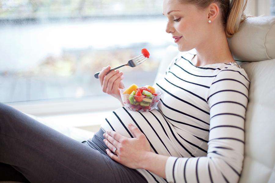 Pregnant Woman Eating Fruit Salad Photograph By Ian Hooton Science 