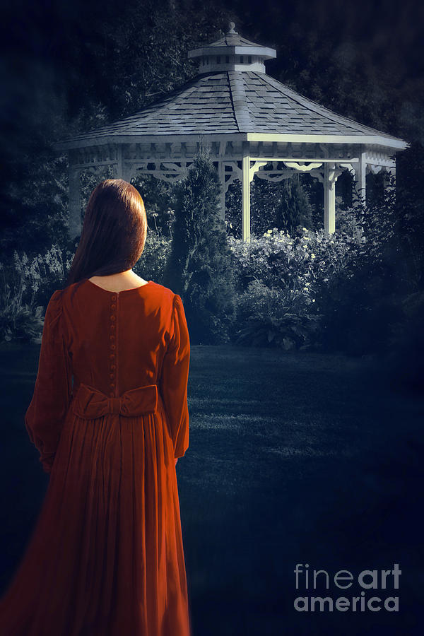 Rear view of a woman looking towards a gazebo at night #1 Photograph by Sandra Cunningham