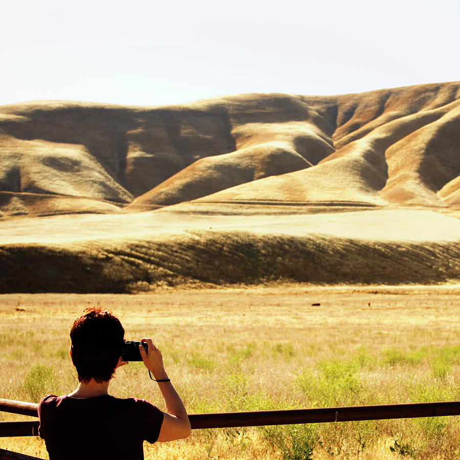 Rear View Of A Woman Taking A Photo Photograph by Ron Koeberer - Pixels