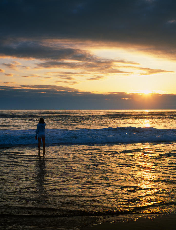 Sunset Photograph - Rear View Of Woman On Beach Looking #1 by Panoramic Images