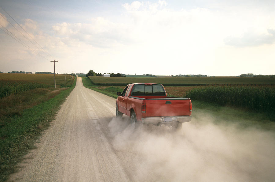 Red Pick Up Truck Traveling Down a Dusty Midwest Road. Photograph by JMichl