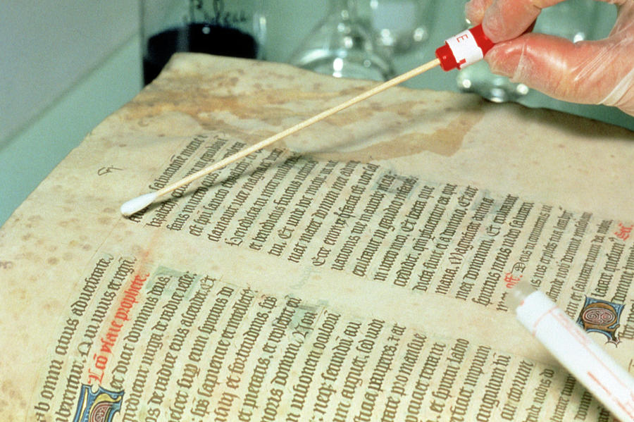 Researcher Tests For Mould On Medieval Manuscript #1 Photograph by Klaus Guldbrandsen/science Photo Library