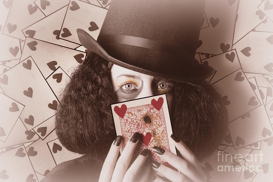 Retro magician holding burnt playing card #1 Photograph by Jorgo Photography