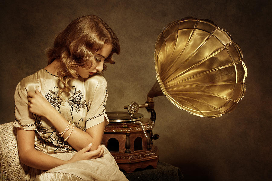 Retro woman listening to music on gramophone #1 Photograph by Mammuth