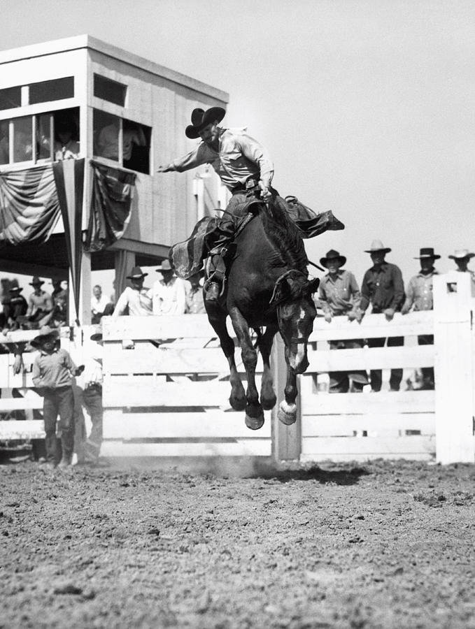 Riding A Bucking Bronco Photograph by Underwood Archives