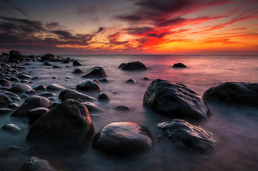 Rocks On A Beach At Sunset By The Sea #1 Photograph by Andreas Jakel