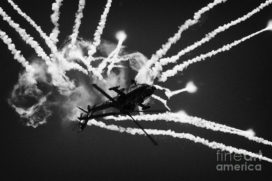 Summer Photograph - Royal Netherlands Air Force Apache AH-64D firing decoy flares RIAT 2005 RAF Fairford  #1 by Joe Fox