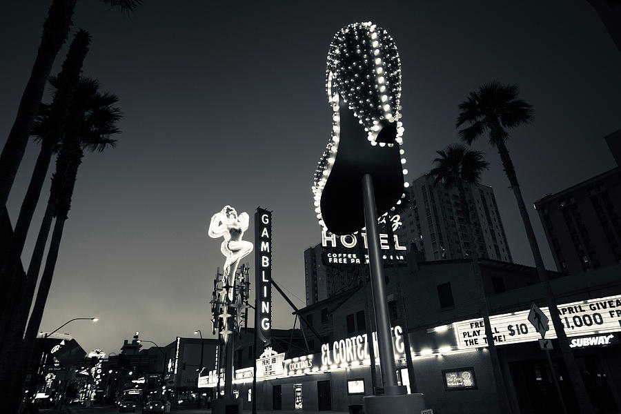 Architecture Photograph - Ruby Slipper Neon Sign Lit Up At Dusk #1 by Panoramic Images