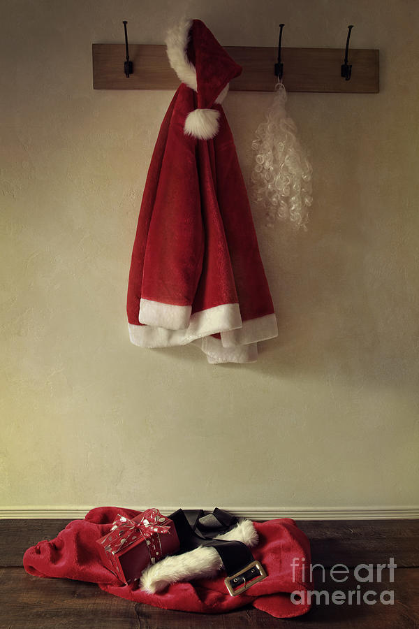 Santa costume hanging on coat rack  #1 Photograph by Sandra Cunningham