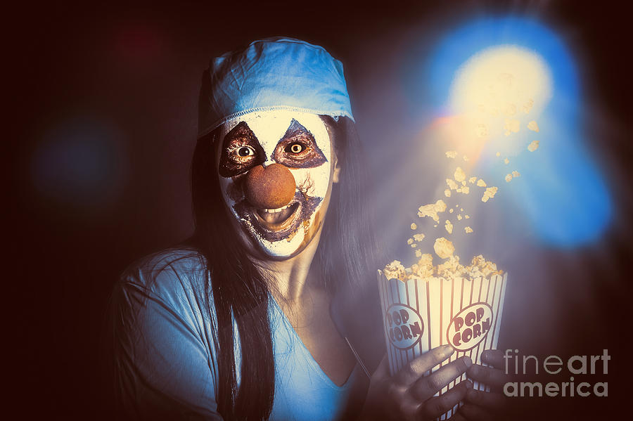 Halloween Movie Photograph - Scary clown watching horror movie in THEATER #1 by Jorgo Photography