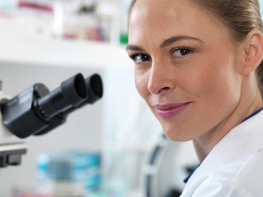 Scientist With Microscope #1 by Science Photo Library