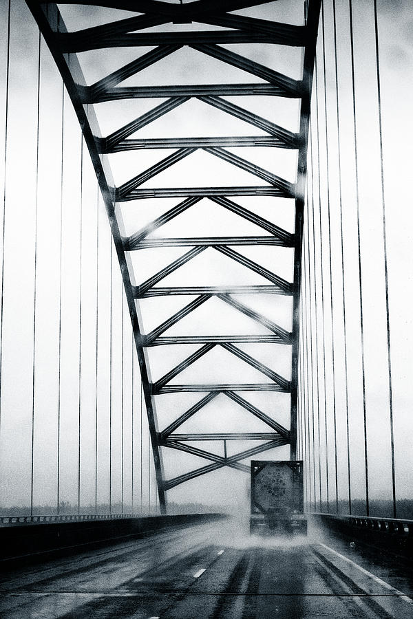 Semi on a bridge in the rain #1 Photograph by Robert FERD Frank