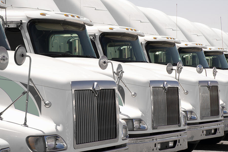 Semi Truck Fleet Photograph by Gunter Nezhoda