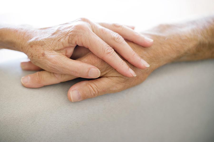 Senior Couple Holding Hands #1 Photograph by Ian Hooton/science Photo Library