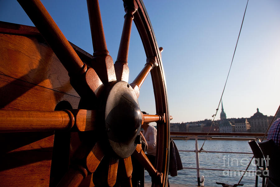 Ship helm and a view on Stockholm #1 Photograph by Michal Bednarek