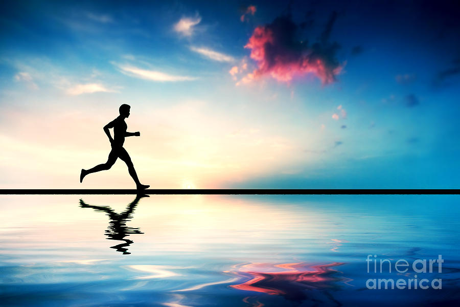 Silhouette Of Man Running At Sunset Photograph