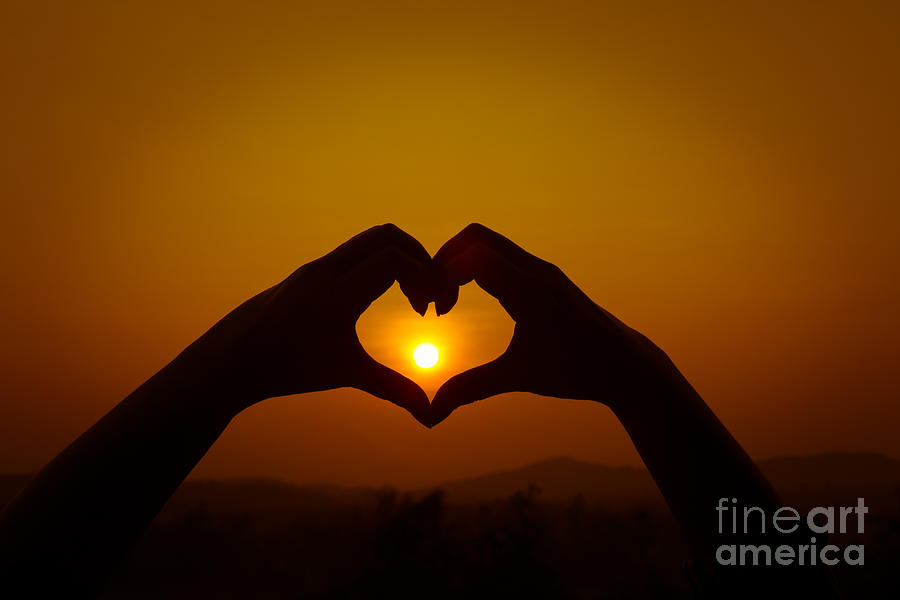 Abstract Photograph - Silhouettes hand heart shaped #1 by Tosporn Preede