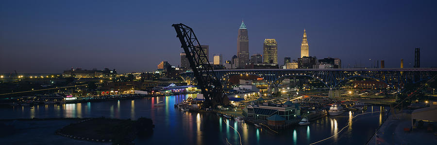 Cleveland Photograph - Skyscrapers Lit Up At Night In A City #1 by Panoramic Images