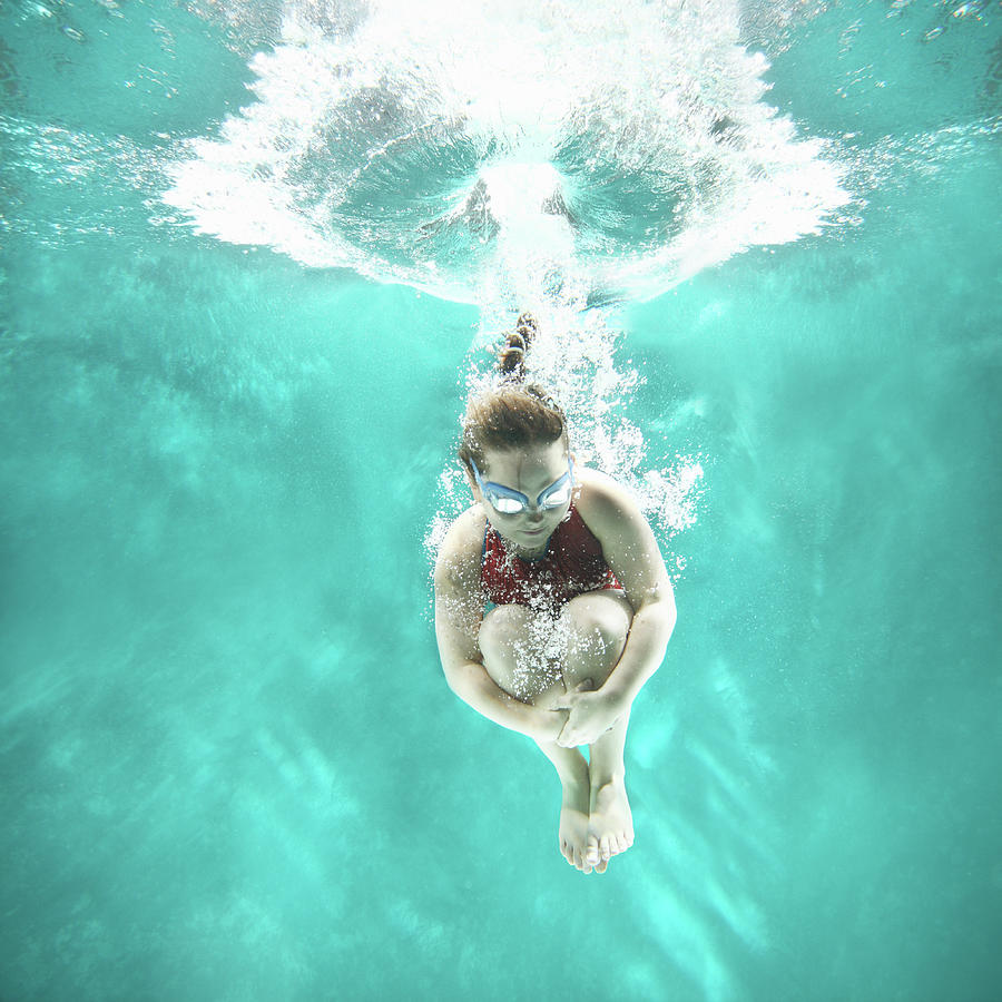 Small Girl Jumping Into The Water- #1 Photograph by Stanislaw Pytel