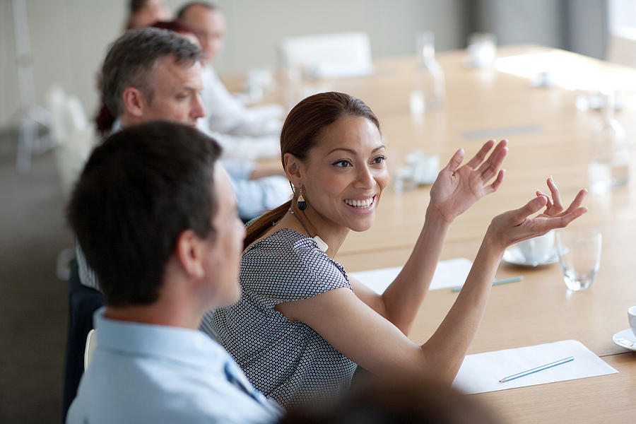 Smiling businesswoman gesturing in meeting in conference room #1 Photograph by Sam Edwards