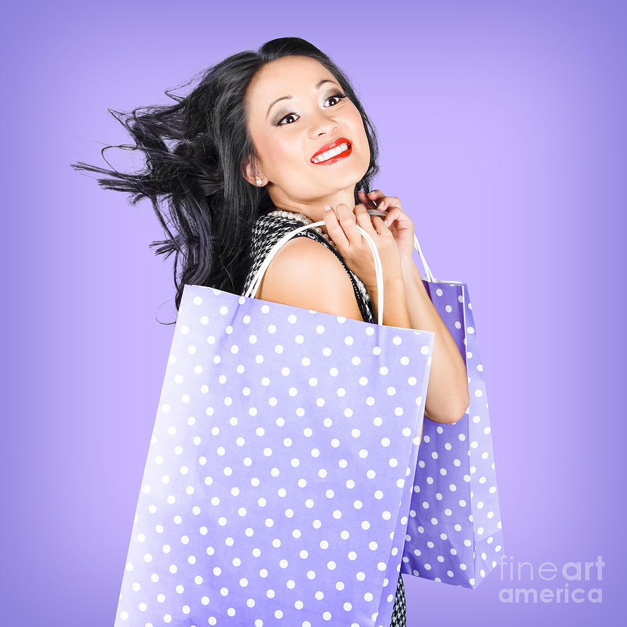 Smiling girl shopper holding purple shopping bags #1 Photograph by Jorgo Photography