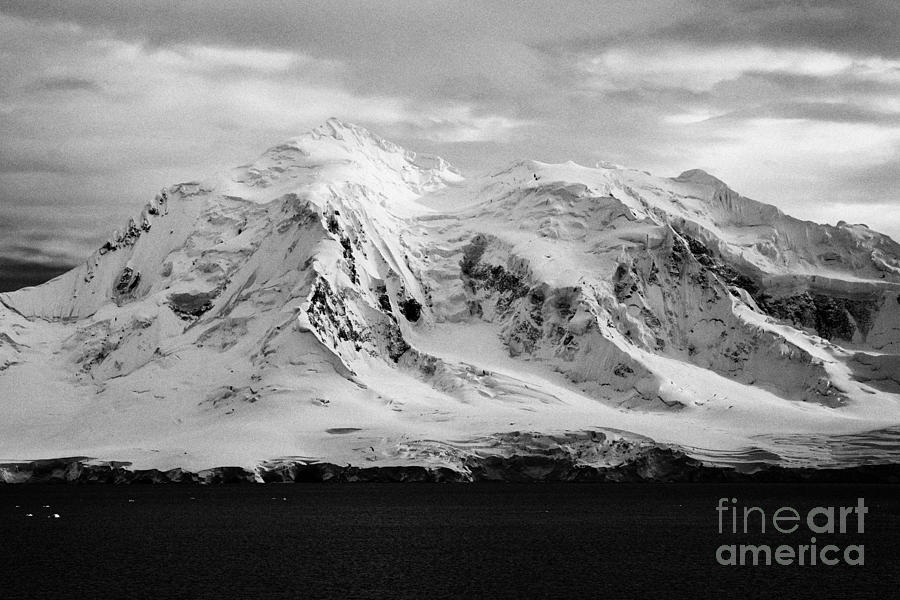 Nature Photograph - snow covered landscape of anvers island mountain range and neumayer channel Antarctica #1 by Joe Fox