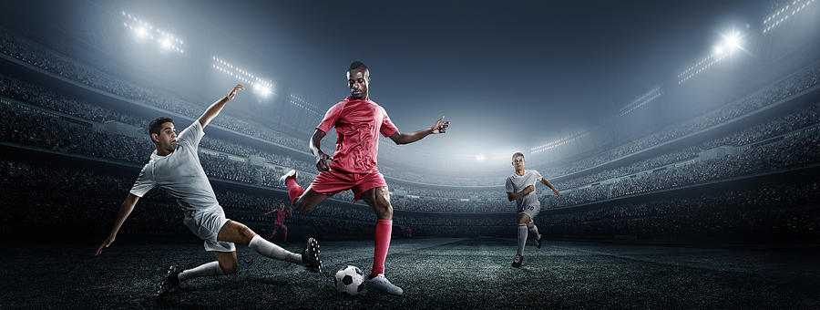 Soccer Player Kicking Ball In Stadium Photograph by Dmytro Aksonov