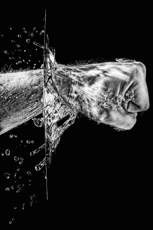Splashing Fist #1 Photograph by Peter Lakomy