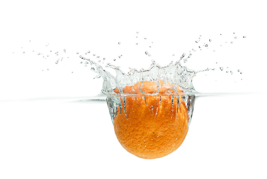 Splashing Orange #1 Photograph by Peter Lakomy