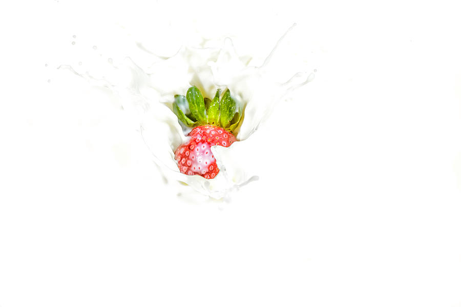 Strawberry in Milk #1 Photograph by Peter Lakomy